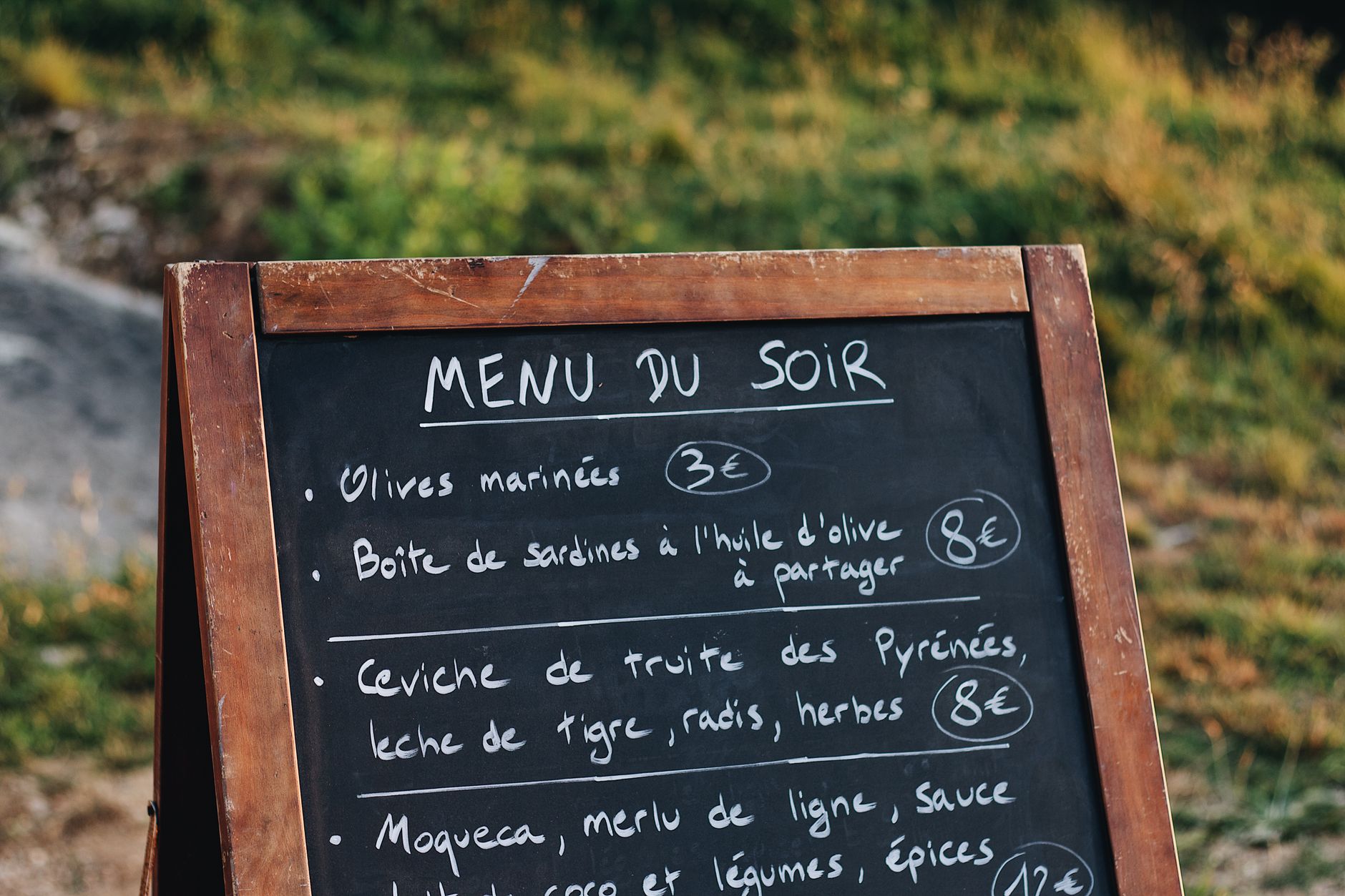 A short chalkboard menu with about a dozen handwritten items